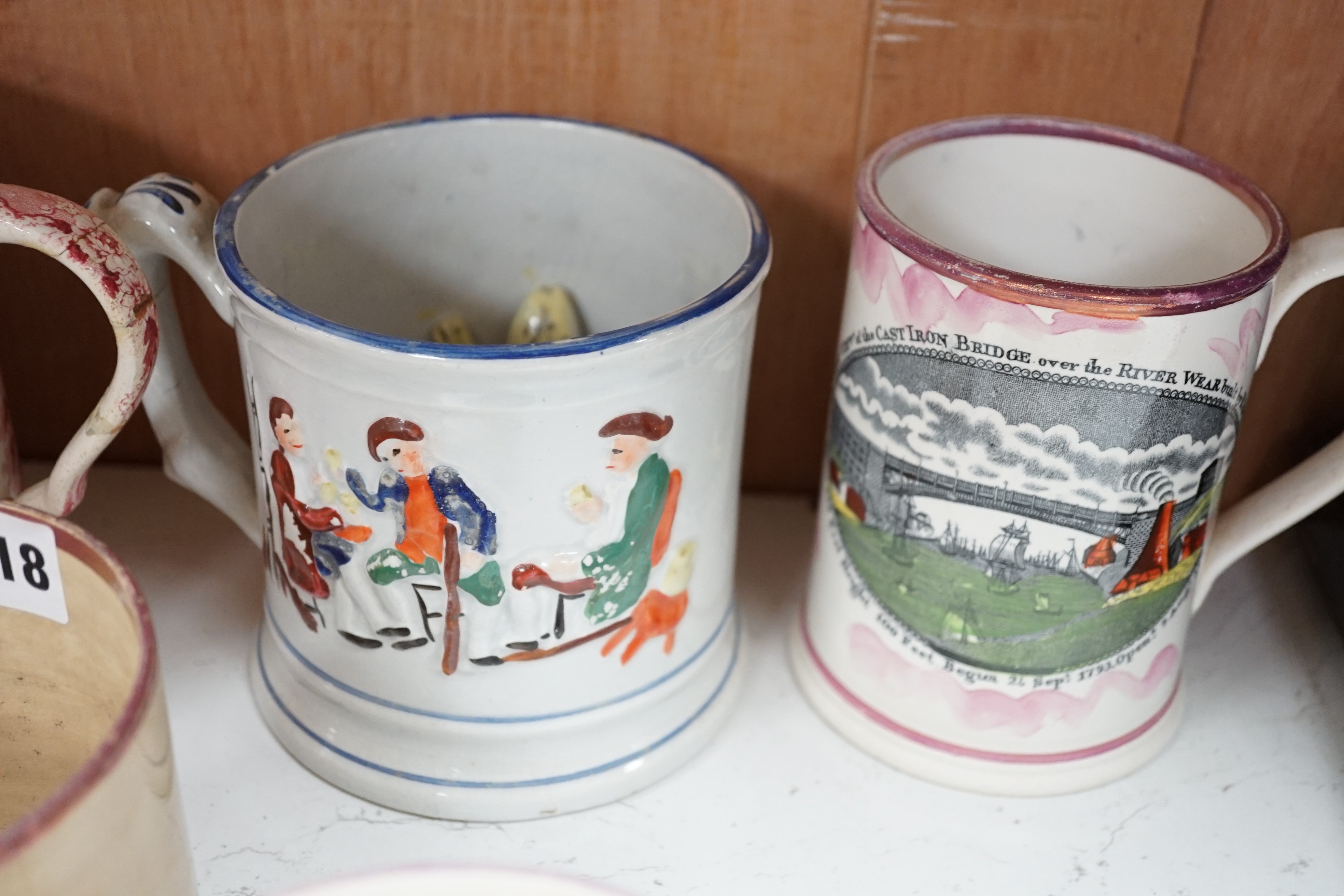 Three Sunderland pink lustre mugs, two Staffordshire pottery 'frog' mugs and two others (7)